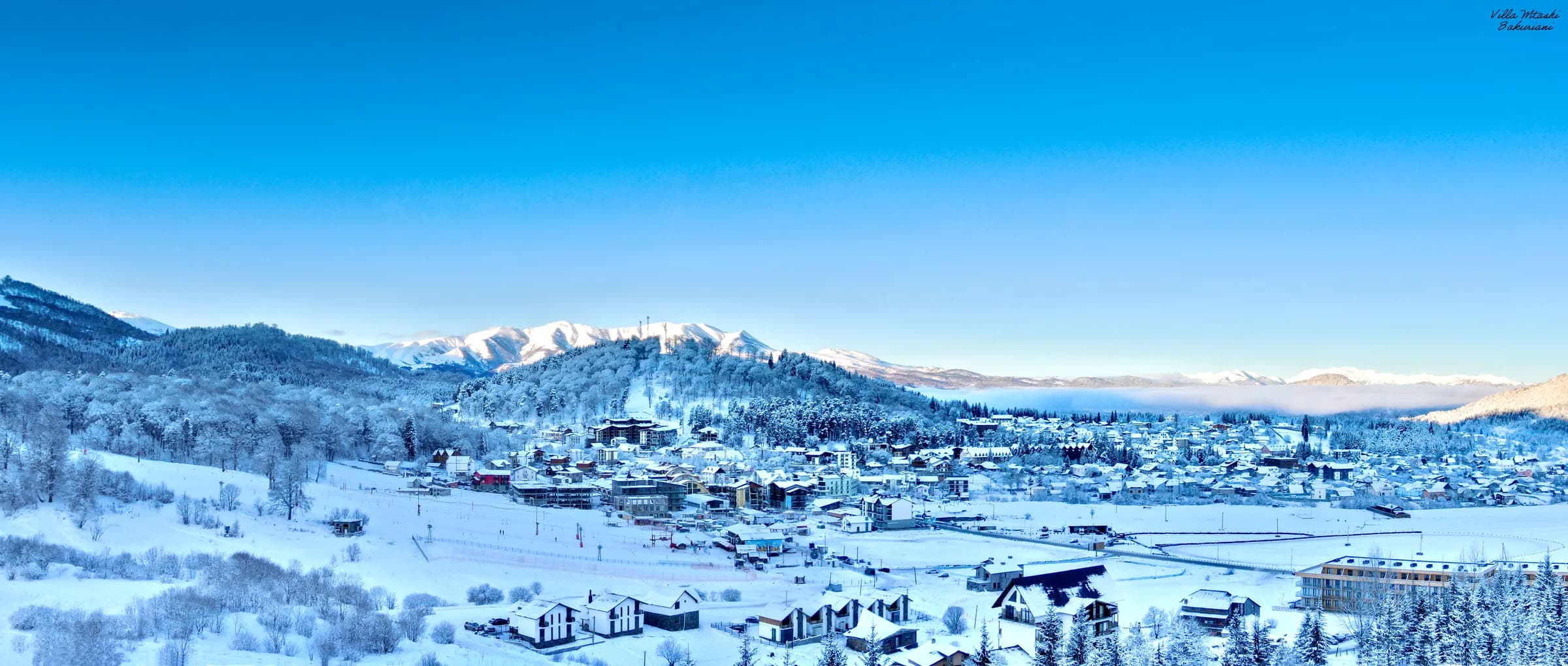 Villa Mtashi winter panorama with snow-covered Bakuriani mountains